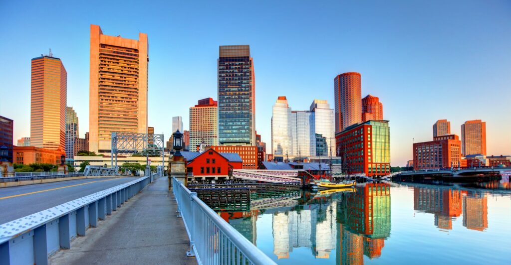 Boston skyline with buidlings reflected in the river.