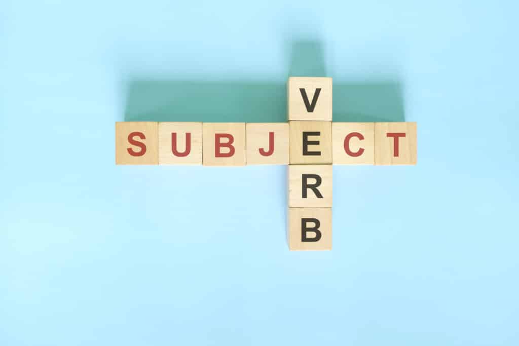 Wood blocks showing the words 'subject' and 'verb'