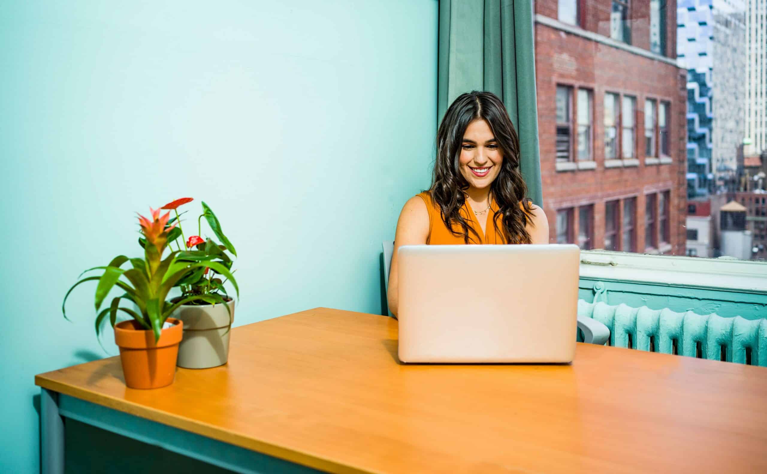 happy woman at laptop